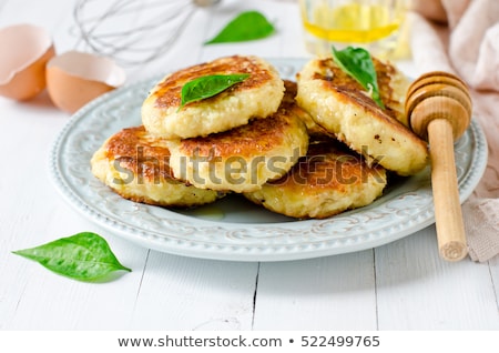 [[stock_photo]]: Cottage Cheese Fritters On White Wooden Background Closeup