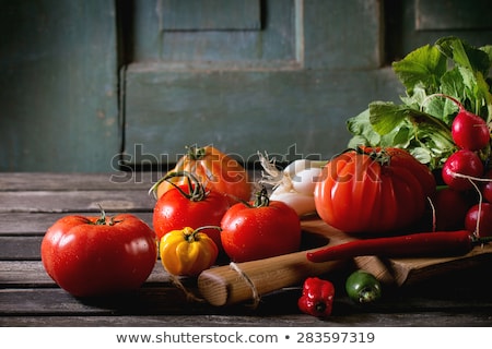 Foto stock: Fresh Red And Yellow Radishes On Dark Rustic Wooden Background Top View