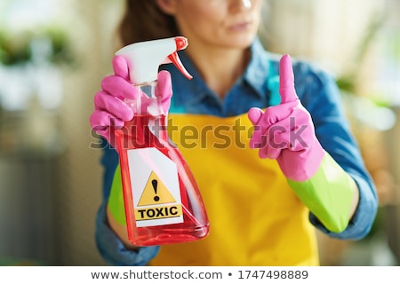 Stockfoto: Sunny Concept With Housekeeper And Orange Gloves