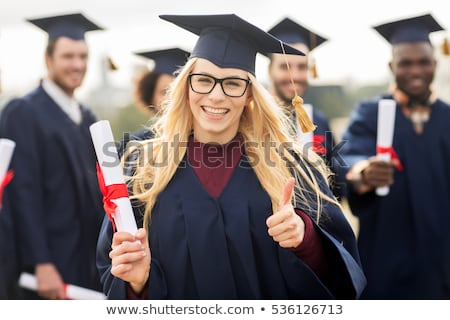 Stok fotoğraf: Graduate Students Or Bachelors Showing Thumbs Up