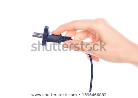 Foto stock: Woman Hand Holding Black Male Wire Plug Isolated On White