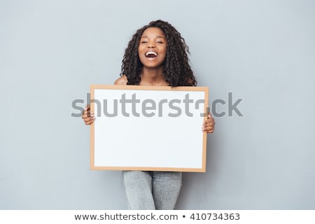 Сток-фото: Happy African American Woman Over Grey Background