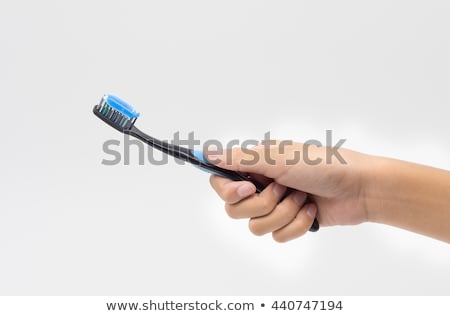 Stock photo: Female Hand Holding Scrubbing Brush