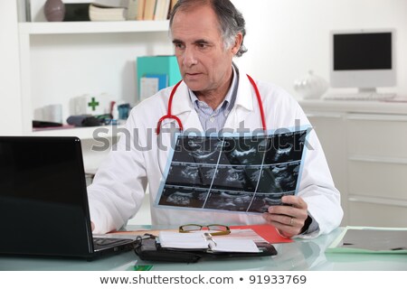 Stock photo: Doctor Entering X Ray Results Into His Database