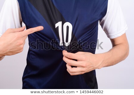 Foto d'archivio: Man Wearing Sport Shirt With Number Ten