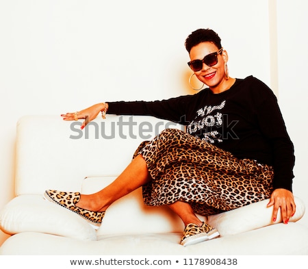 [[stock_photo]]: Pretty Stylish African American Big Mama Woman Well Dressed Swag Relax At Home Leopard Print On Cl