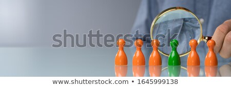 Stok fotoğraf: Man Holding Magnifying Glass Over Pawn Chess Piece