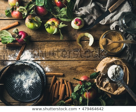 Foto stock: Close Up Of Apple Pie In Mold On Wooden Table