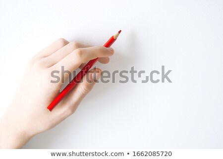 Foto stock: Hand With Red Pencil