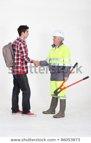 Stok fotoğraf: Senior Craftsman And Young Apprentice Shaking Hands