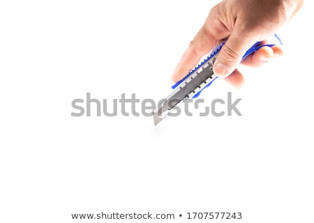 Foto stock: Hand Holding A Utility Blade