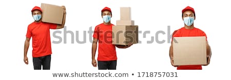 Foto stock: Man Carrying Boxes
