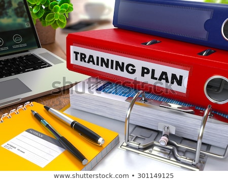 Foto stock: Red Ring Binder With Inscription Training Plan