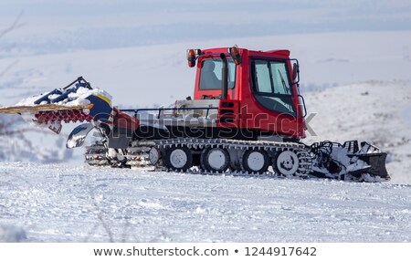 Foto stock: Red Snow Groomer In The Mountain