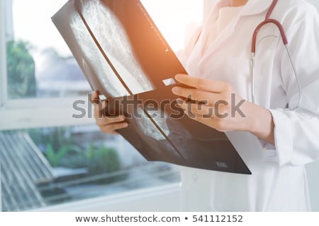 ストックフォト: Pensive Female Doctor Looking At X Ray