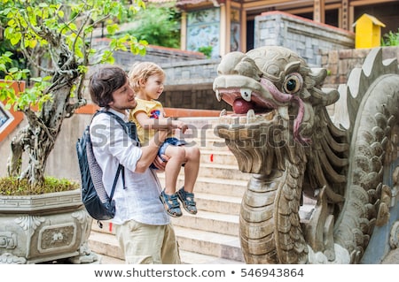 Stok fotoğraf: Happy Tourists Dad And Son In Pagoda Travel To Asia Concept Traveling With A Baby Concept