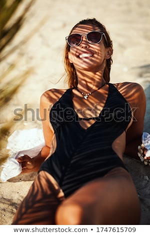 Young Woman Relaxing Under The Palm Tree Vertical Shot Stockfoto © MilanMarkovic78