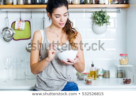 Stock photo: Young Woman Eating Strawberry