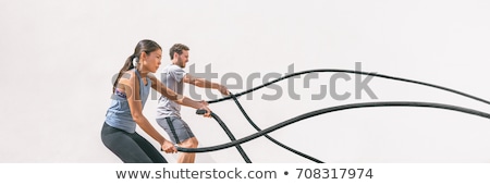 Stock photo: Crossfit Battling Ropes At Gym Workout Exercise