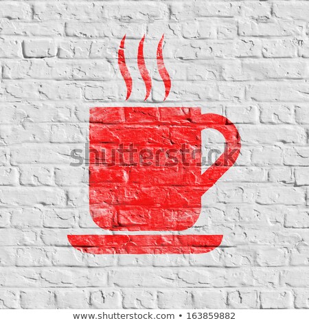 Foto stock: Red Cup Of Coffee Icon On White Brick Wall