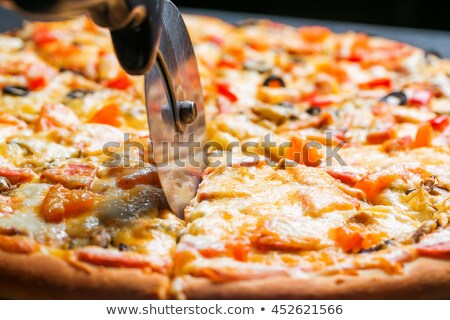 Zdjęcia stock: Chef Knife Cuts Pizza