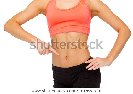 Stock fotó: Close Up Of Woman Pointing Finger At Her Abs