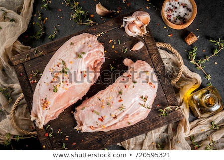 Stockfoto: Raw Chicken Breasts Fillets With Thyme And Spices On Wooden Cutting Board On Rustic Background Copy