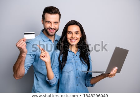 Stockfoto: Image Of Two Joyful Women Smiling And Holding Credit Cards Isol