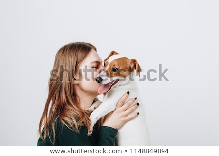 Foto d'archivio: Woman Hugging Her Little White Dog