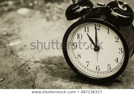 Stockfoto: Clock Showing Eleven Oclock With Grunge Aged Effects