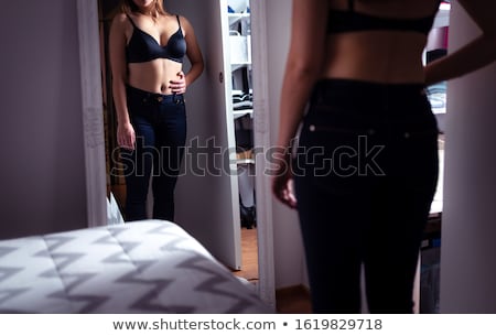 Stok fotoğraf: Sad Woman Looking In The Mirror