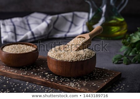 Stock photo: Sesame Seeds With Wooden Spoon Scoopful