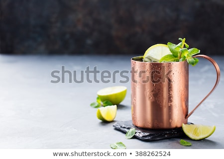 Stok fotoğraf: Cold Moscow Mules Cocktail With Ginger Beer Vodka Lime Grey Stone Background Copy Space
