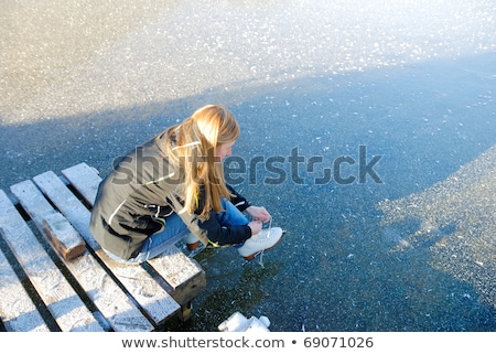 Stok fotoğraf: Beautiful Woman Putting On Her Shoes