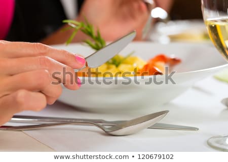 Stok fotoğraf: People Fine Dining Seafood And White Wine On The Table