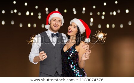 Stockfoto: Happy Couple Hugging At Party Over Garland Lights