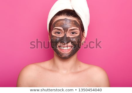 Foto stock: Woman Posing Isolated Over Pink Background Take Care Of Her Skin Holding Cream Lotion Gel