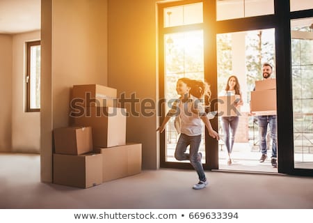 Stock foto: Happy Couple With Boxes Moving To New Home