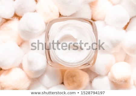 Foto stock: Luxury Face Cream For Sensitive Skin And Eco Cotton Balls On Bac