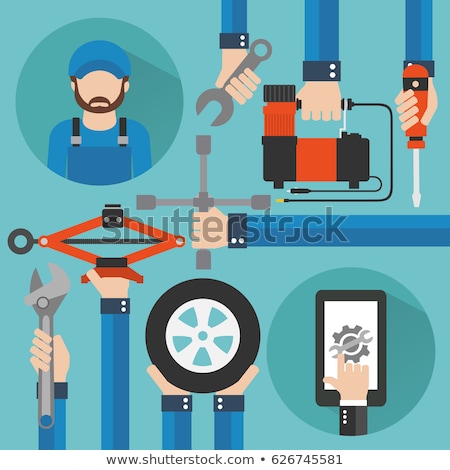 Zdjęcia stock: Mechanic With Screwdriver Changing Car Tire