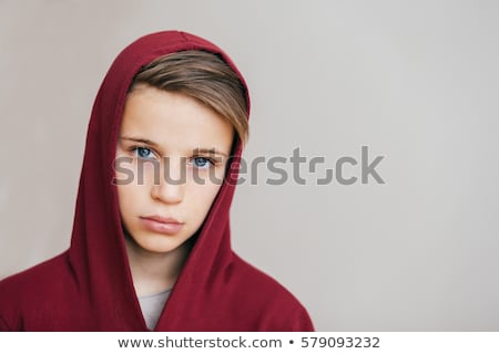 Foto stock: Cool Boy With Red Hair Posing In Studio