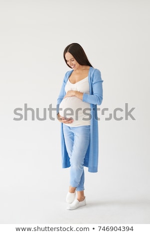 Stock photo: Pregnant Woman Posing In Studio