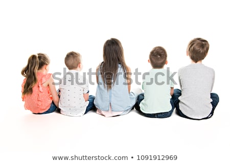 Stock photo: Back View Of Child Group Sitting On Floor Looking At Wall