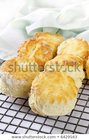 Foto d'archivio: Home Made Scones With Strawberry Jam And A Cup Of Tea