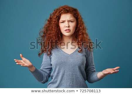 Stock fotó: Portrait Of Confused Young Girl With Curly Hair