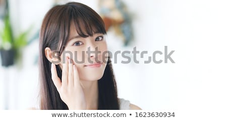 Stok fotoğraf: Beauty Woman Applying Makeup Or Face Cream Lotion How To Apply Concealer Technique Demonstration