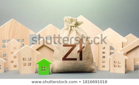 [[stock_photo]]: City Residential Buildings And Polish Zloty Money Bag With A Red Down Arrow Lower Mortgage Interest