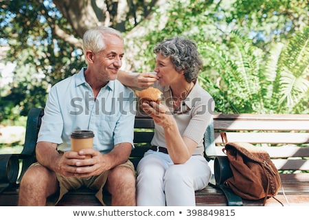 Foto stock: Senior Having Coffee Outdoors