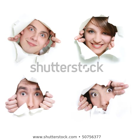 Zdjęcia stock: Couple Peeking Through Hole In Paper