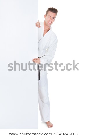 Stockfoto: Young Man In Kimono Holding Placard